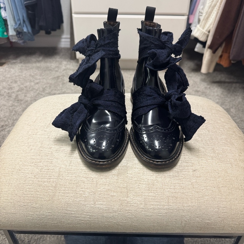 AGL Brogue’s Midnight-Blue Patent Leather Ankle Boots with Bow Detail